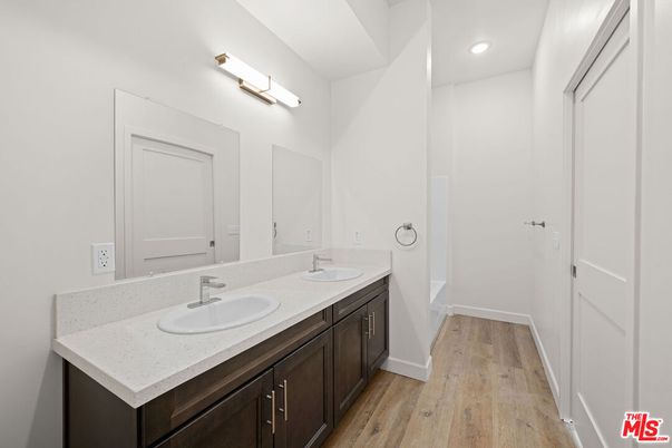 Bathroom, Dual Sink Vanities, Interior, Recessed Lighting, Wood Texture Flooring