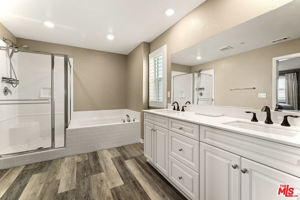 Bathroom, Dual Sink Vanities, Glass Shower, Interior, Recessed Lighting, Wood Texture Flooring