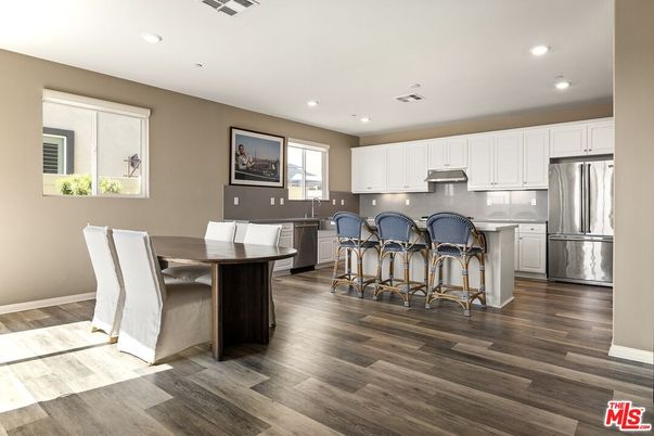 Dining room, Interior, Kitchen, Recessed Lighting, Stainless Steel Appliances, Wood Texture Flooring