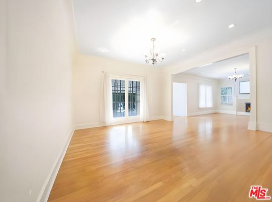 Chandelier, Empty room, Fireplace, Interior, Recessed Lighting, Wood Texture Flooring