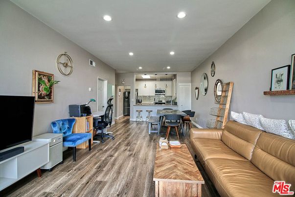 Dining room, Interior, Kitchen, Living room, Recessed Lighting, Stainless Steel Appliances, Wood Texture Flooring