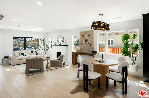 Chandelier, Dining room, Fireplace, Interior, Living room, Recessed Lighting, Wood Texture Flooring
