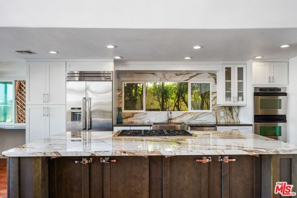 Interior, Kitchen, Marble Walls, Recessed Lighting, Stainless Steel Appliances, Wood Texture Flooring
