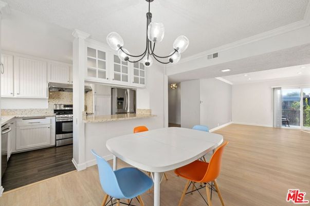 Dining room, Interior, Kitchen, Pendant Lights, Recessed Lighting, Stainless Steel Appliances, Wood Texture Flooring