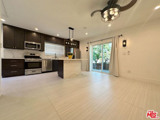 Interior, Kitchen, Marble Walls, Pendant Lights, Recessed Lighting, Stainless Steel Appliances