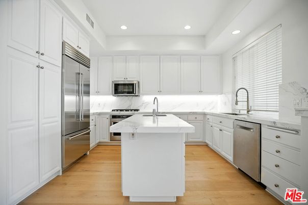 Interior, Kitchen, Marble Walls, Recessed Lighting, Stainless Steel Appliances, Wood Texture Flooring