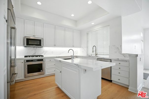 Interior, Kitchen, Marble Walls, Recessed Lighting, Stainless Steel Appliances, Wood Texture Flooring