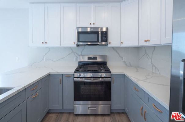 Interior, Kitchen, Marble Walls, Stainless Steel Appliances, Wood Texture Flooring