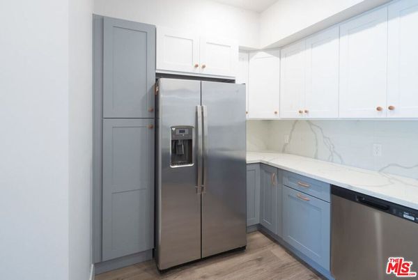 Interior, Kitchen, Marble Walls, Stainless Steel Appliances, Wood Texture Flooring
