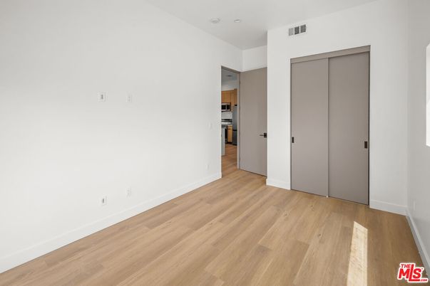Empty room, Interior, Kitchen, Stainless Steel Appliances, Wood Texture Flooring