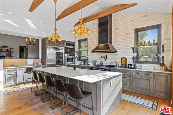 Chandelier, Interior, Kitchen, Pendant Lights, Recessed Lighting, Stainless Steel Appliances, Stone Walls, Wooden Beams, Wood Texture Flooring