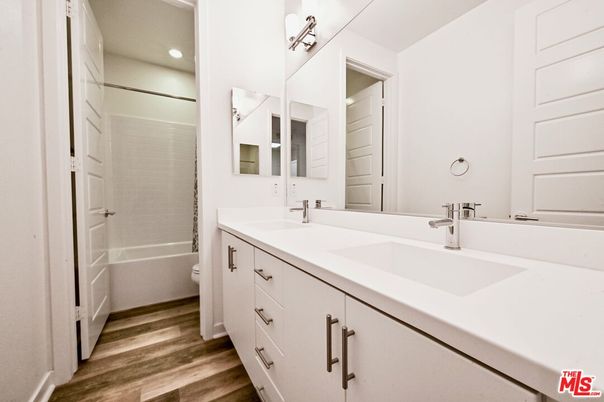 Bathroom, Dual Sink Vanities, Interior, Recessed Lighting, Wood Texture Flooring