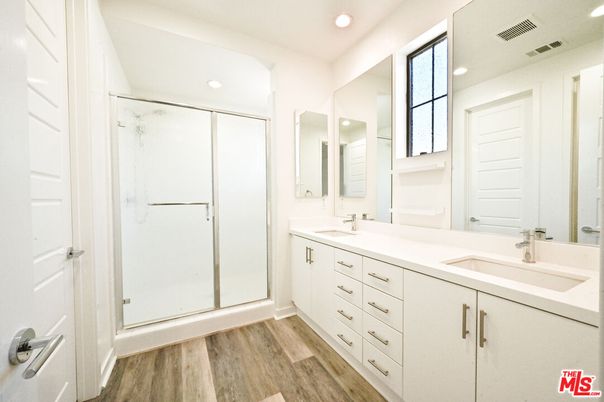 Bathroom, Dual Sink Vanities, Glass Shower, Interior, Recessed Lighting, Walk-in Closets, Wood Texture Flooring