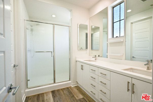 Bathroom, Dual Sink Vanities, Glass Shower, Interior, Recessed Lighting, Wood Texture Flooring