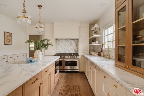 Interior, Kitchen, Marble Walls, Pendant Lights, Recessed Lighting, Stainless Steel Appliances, Wood Texture Flooring