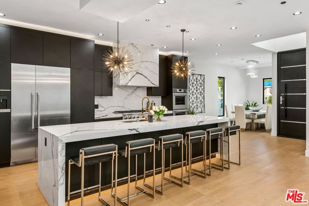 Interior, Kitchen, Marble Walls, Pendant Lights, Recessed Lighting, Stainless Steel Appliances, Wood Texture Flooring