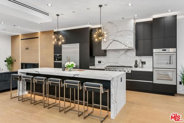 Interior, Kitchen, Marble Walls, Pendant Lights, Recessed Lighting, Stainless Steel Appliances, Wood Texture Flooring
