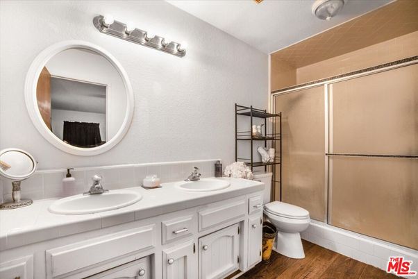 Bathroom, Dual Sink Vanities, Glass Shower, Interior, Tile Countertops, Wood Texture Flooring