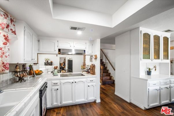 Interior, Kitchen, Recessed Lighting, Tile Countertops, Wood Texture Flooring