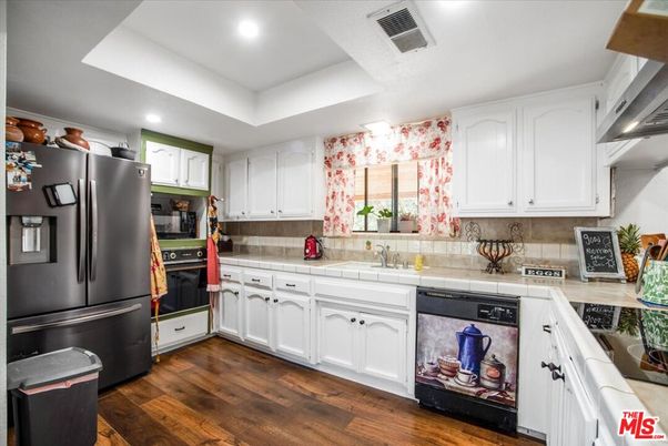 Interior, Kitchen, Recessed Lighting, Tile Countertops, Wood Texture Flooring