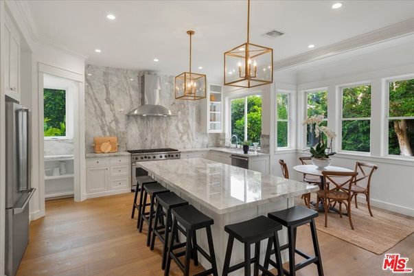 Dining room, Interior, Kitchen, Marble Walls, Pendant Lights, Recessed Lighting, Stainless Steel Appliances, Wood Texture Flooring