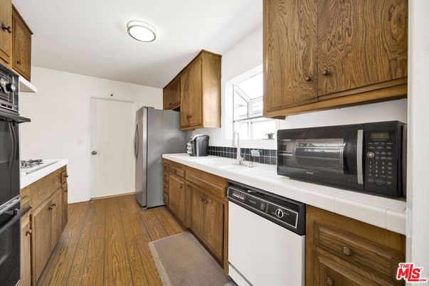 Interior, Kitchen, Tile Countertops, Wood Texture Flooring