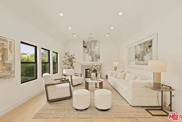 Fireplace, Interior, Living room, Marble Walls, Recessed Lighting, Wood Texture Flooring