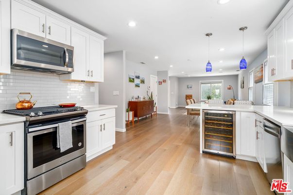 Dining room, Interior, Kitchen, Pendant Lights, Recessed Lighting, Stainless Steel Appliances, Wood Texture Flooring