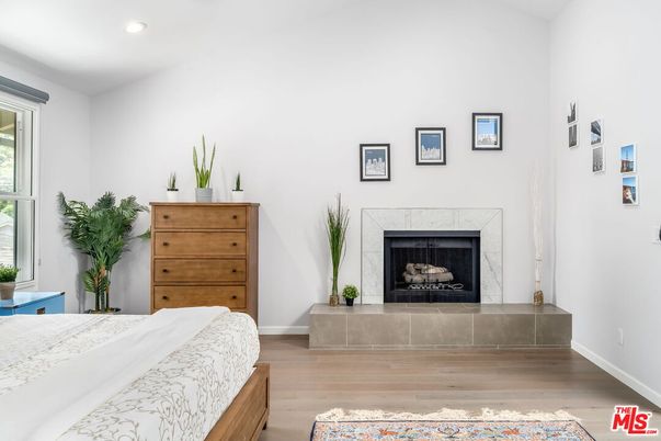 Bedroom, Fireplace, Interior, Recessed Lighting, Wood Texture Flooring