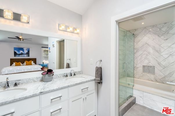 Bathroom, Dual Sink Vanities, Glass Shower, Interior, Marble Walls, Recessed Lighting