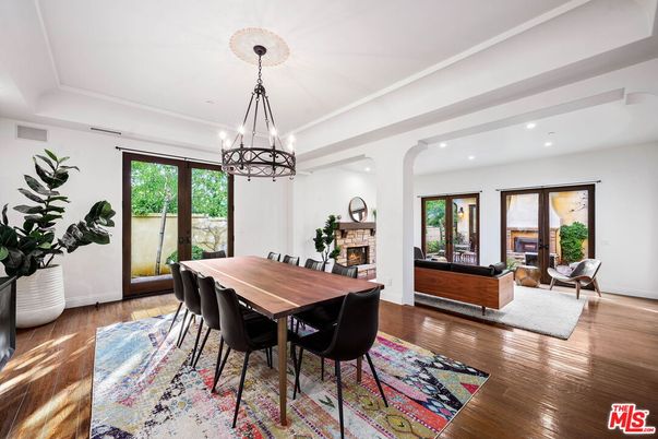 Chandelier, Dining room, Fireplace, Interior, Living room, Pendant Lights, Recessed Lighting, Wood Texture Flooring
