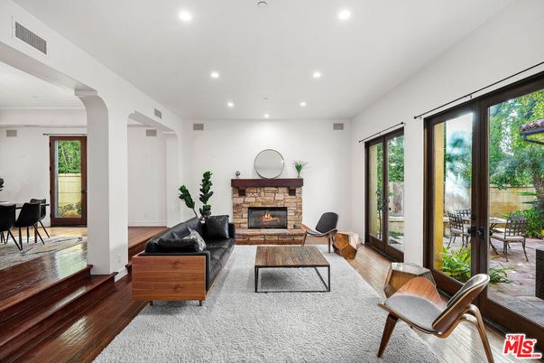Dining room, Fireplace, Interior, Living room, Recessed Lighting, Wood Texture Flooring