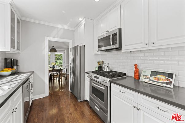 Dining room, Interior, Kitchen, Pendant Lights, Recessed Lighting, Stainless Steel Appliances, Wood Texture Flooring