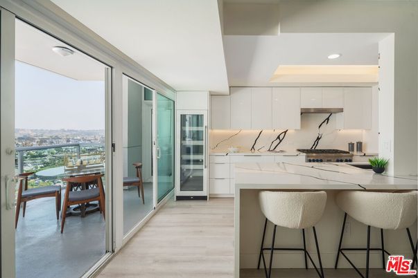 Dining room, Interior, Kitchen, Marble Walls, Recessed Lighting, Stainless Steel Appliances, Water, Wood Texture Flooring