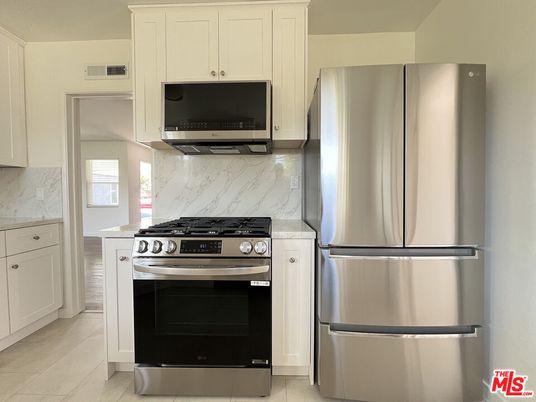 Interior, Kitchen, Marble Walls, Stainless Steel Appliances