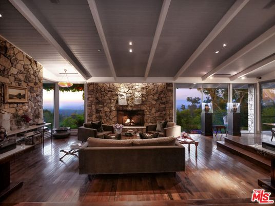 Fireplace, Interior, Living room, Pendant Lights, Recessed Lighting, Stone Walls, Wood Texture Flooring