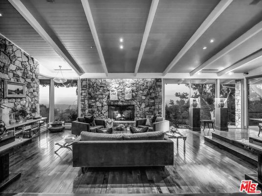 Fireplace, Interior, Living room, Recessed Lighting, Stone Walls, Wood Texture Flooring
