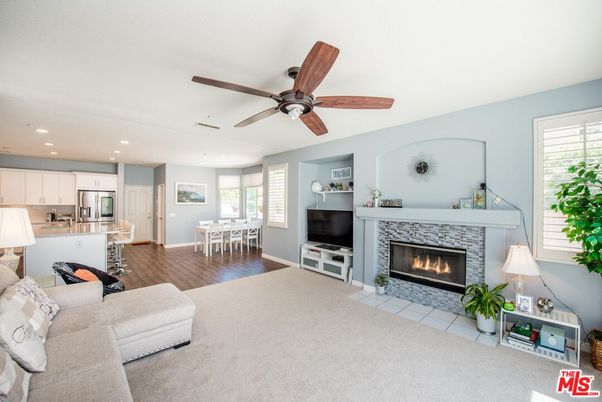 Dining room, Fireplace, Interior, Kitchen, Living room, Recessed Lighting, Stainless Steel Appliances, Wood Texture Flooring