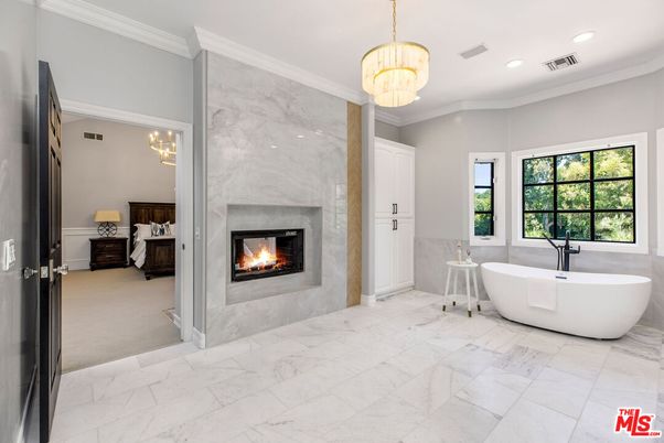 Bathroom, Chandelier, Fireplace, Free Standing Baths, Interior, Marble, Marble Walls, Pendant Lights, Recessed Lighting