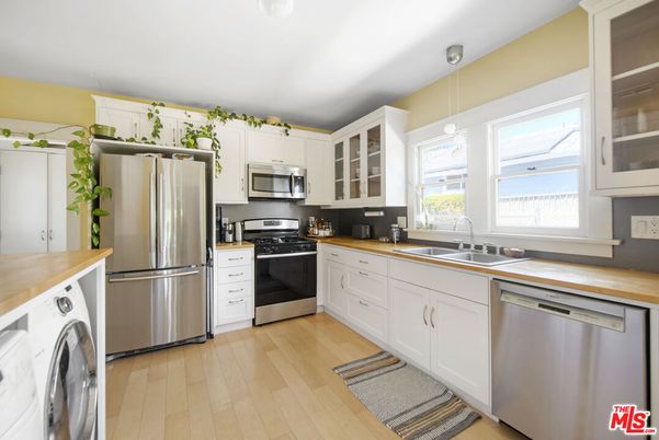 Interior, Kitchen, Pendant Lights, Stainless Steel Appliances, Washer, Wood Texture Flooring