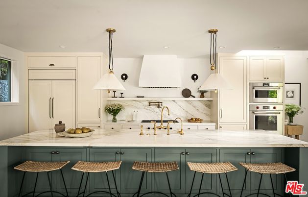 Interior, Kitchen, Marble Walls, Pendant Lights, Recessed Lighting, Stainless Steel Appliances