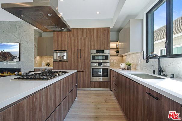 Interior, Kitchen, Marble Walls, Recessed Lighting, Stainless Steel Appliances, Wood Texture Flooring
