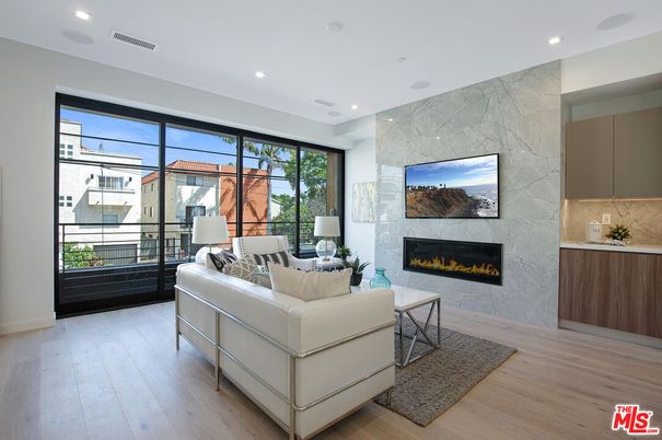 Fireplace, Interior, Living room, Marble Walls, Recessed Lighting, Wood Texture Flooring