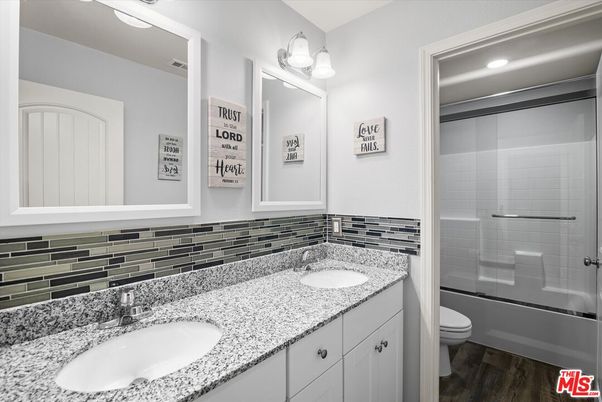 Bathroom, Dual Sink Vanities, Glass Shower, Interior, Recessed Lighting, Wood Texture Flooring