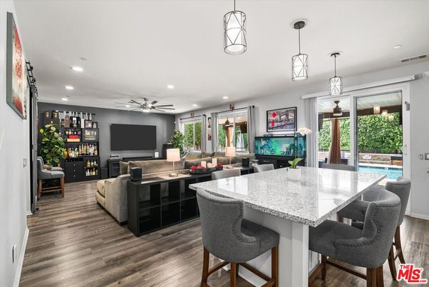 Dining room, Fireplace, Interior, Living room, Pendant Lights, Recessed Lighting, Wood Texture Flooring