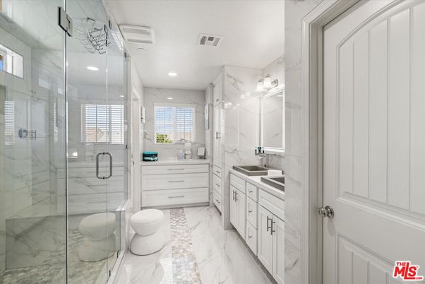 Bathroom, Dual Sink Vanities, Glass Shower, Interior, Marble, Marble Walls, Recessed Lighting