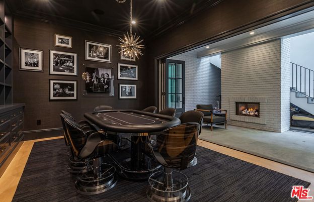 Dining room, Fireplace, Game Room, Interior, Pendant Lights, Recessed Lighting, Stone Walls, Wood Texture Flooring