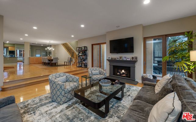 Chandelier, Dining room, Fireplace, Interior, Living room, Pendant Lights, Recessed Lighting, Wood Texture Flooring