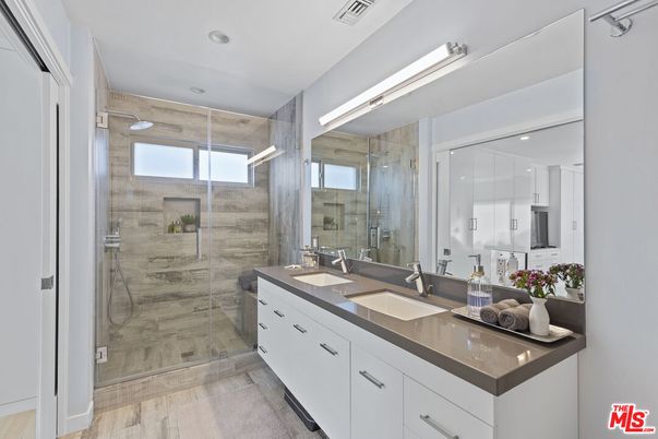 Bathroom, Dual Sink Vanities, Glass Shower, Interior, Recessed Lighting, Wood Texture Flooring