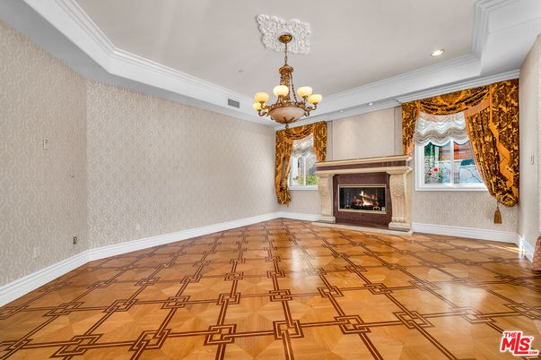 Chandelier, Empty room, Fireplace, Interior, Recessed Lighting, Wood Texture Flooring